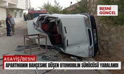 Besni'de apartmanın bahçesine düşen otomobilin sürücüsü yaralandı