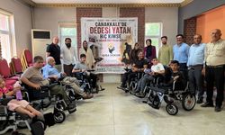 Eruh'ta 10 engelliye elektrikli tekerlekli sandalye verildi