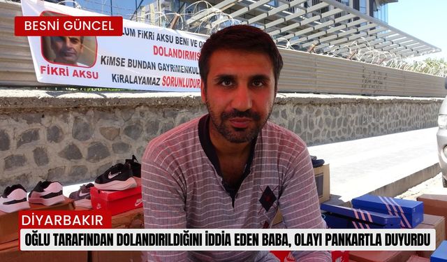 Oğlu tarafından dolandırıldığını iddia eden baba, olayı pankartla duyurdu